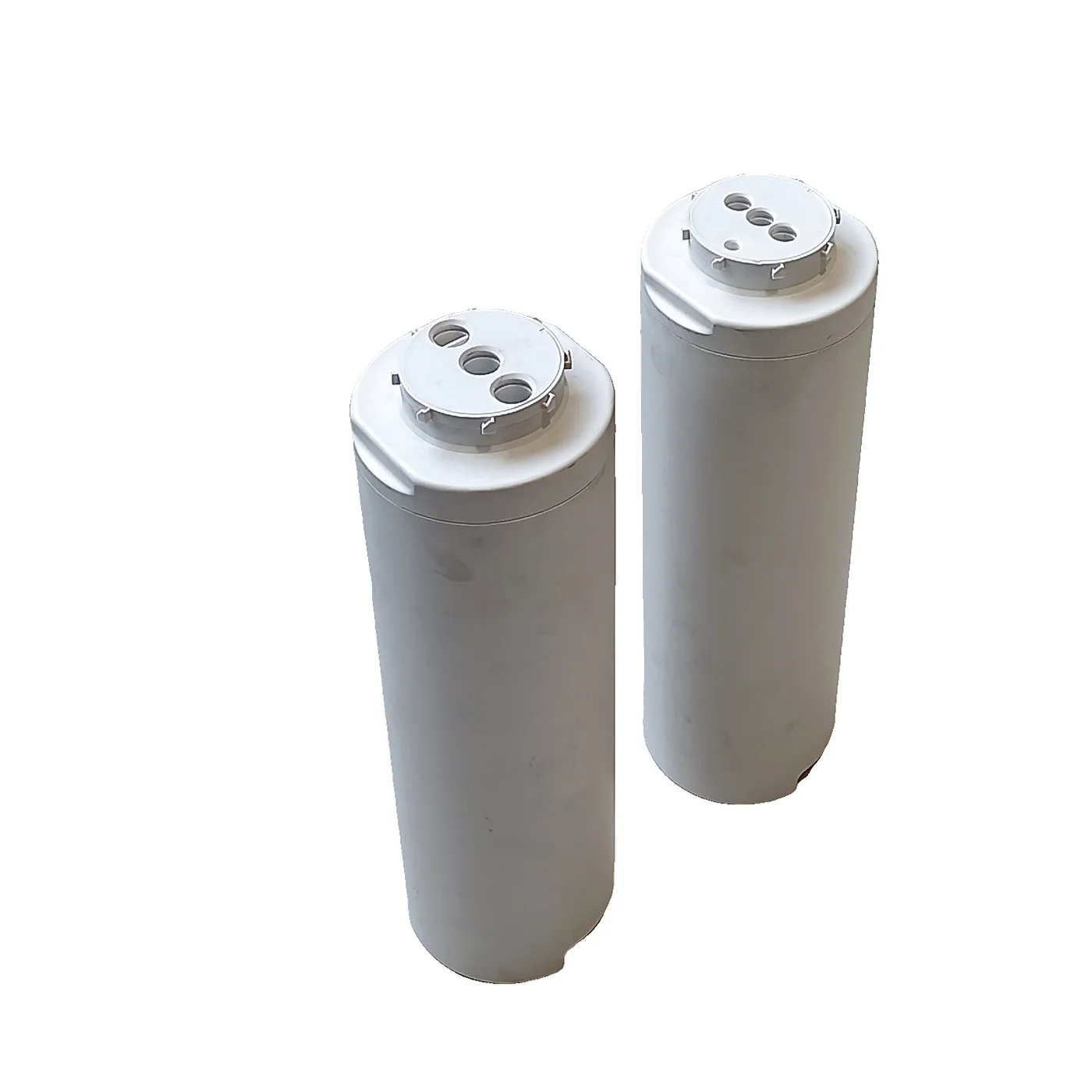White cylindrical housing and valve seat assembly
